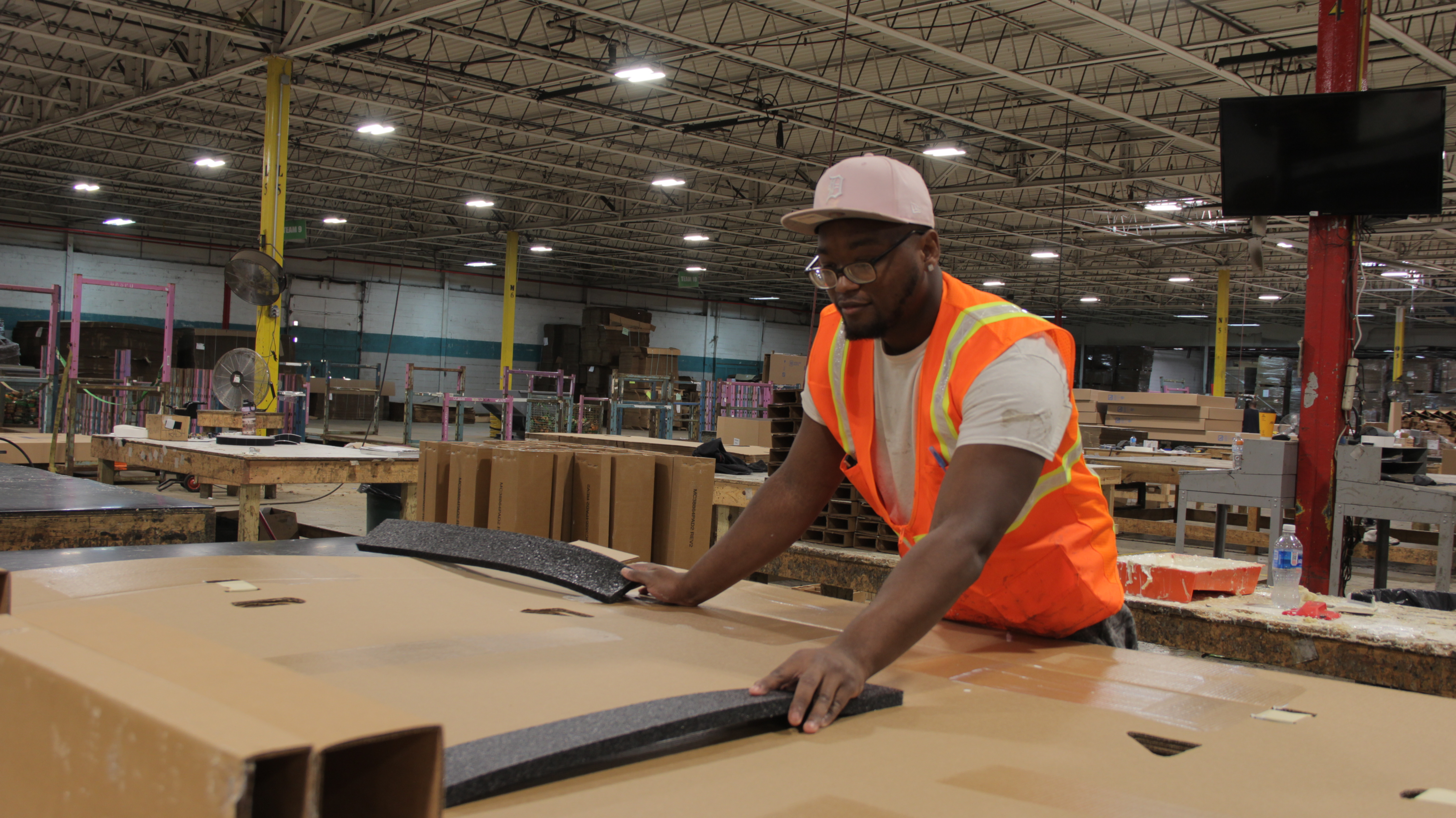 NorthGate team member hand-assembling packaging on the floor